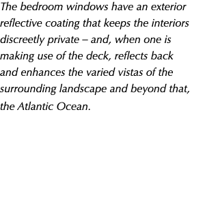 The bedroom windows have an exterior reflective coating that keeps the interiors discreetly private – and, when one i...